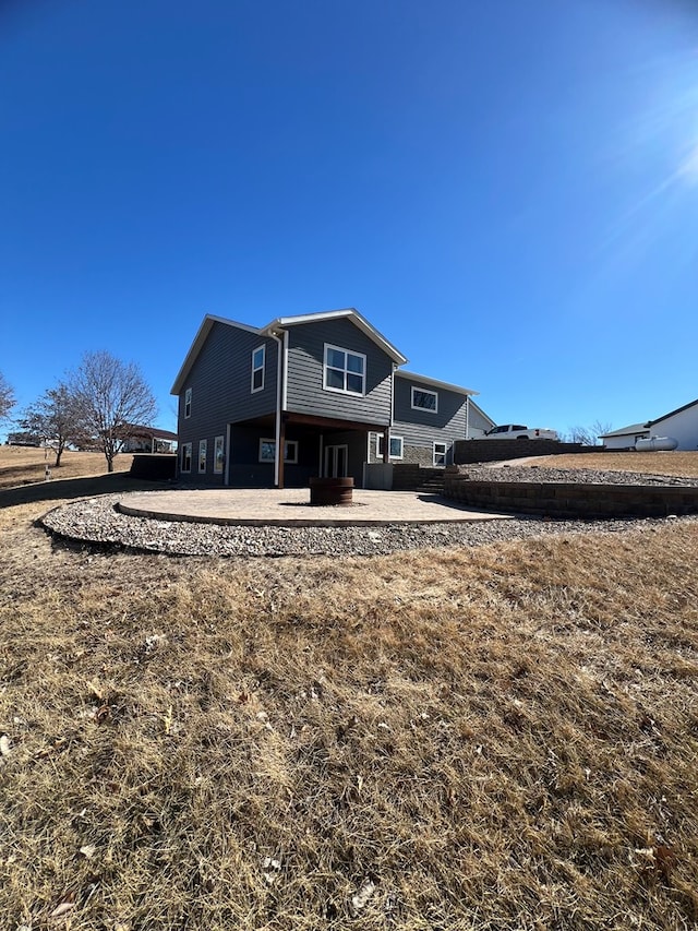 rear view of house featuring a patio