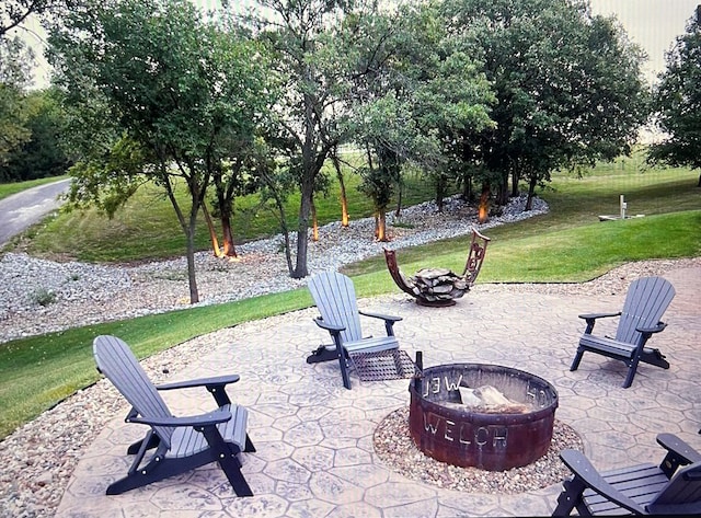 view of patio / terrace with a fire pit