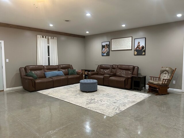 living room with concrete flooring