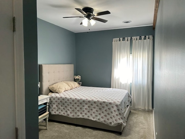 carpeted bedroom featuring ceiling fan