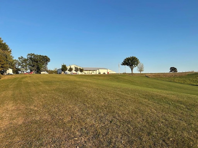 view of yard with a rural view