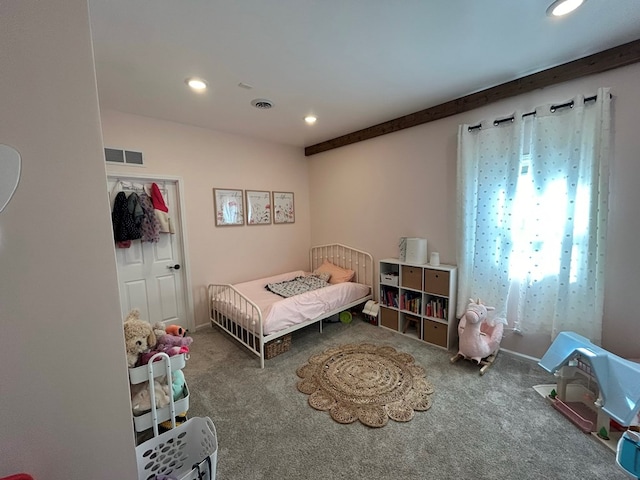 bedroom featuring carpet flooring and beamed ceiling