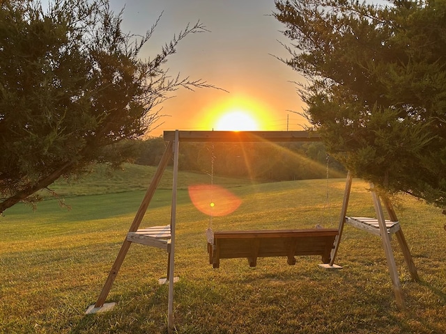 playground at dusk with a yard