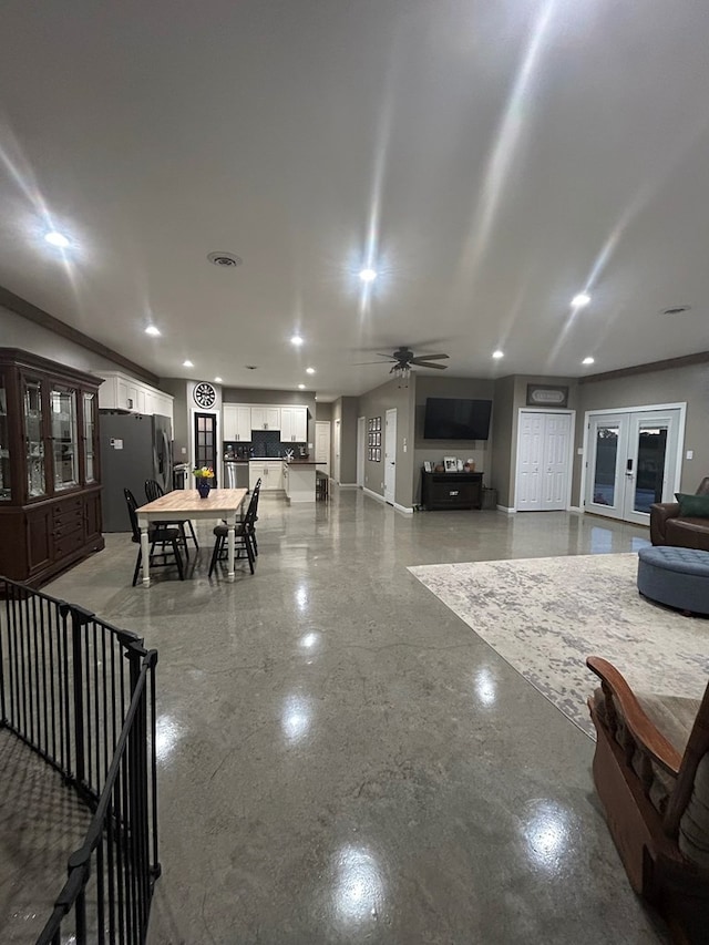 dining space featuring french doors and ceiling fan