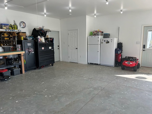 garage featuring white refrigerator