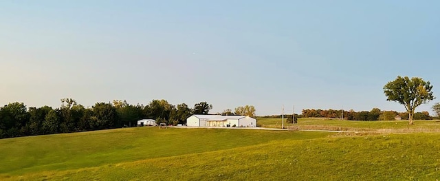 view of yard with a rural view