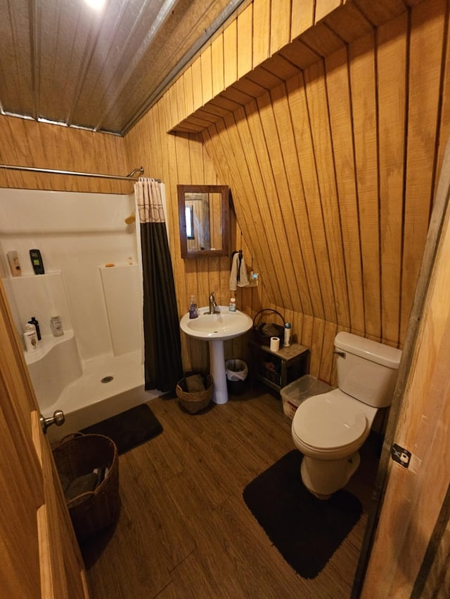 bathroom featuring toilet, wood ceiling, wood-type flooring, wooden walls, and curtained shower