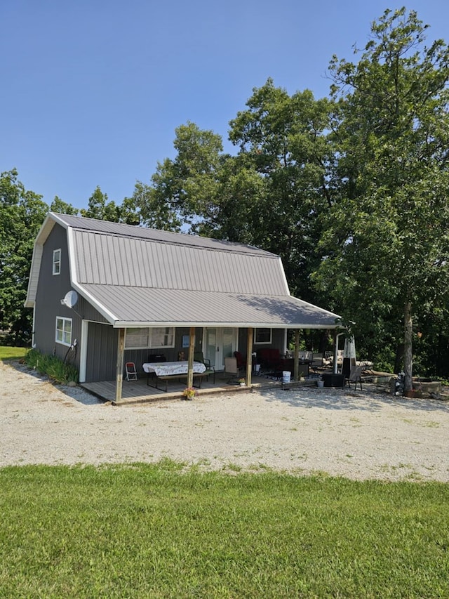 view of home's community featuring a hot tub and a lawn