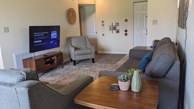 living room featuring visible vents and baseboards