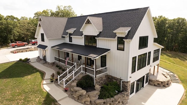 exterior space with a yard and covered porch