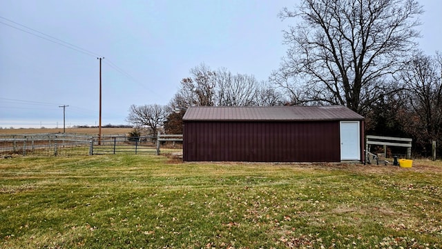 view of outbuilding featuring a yard