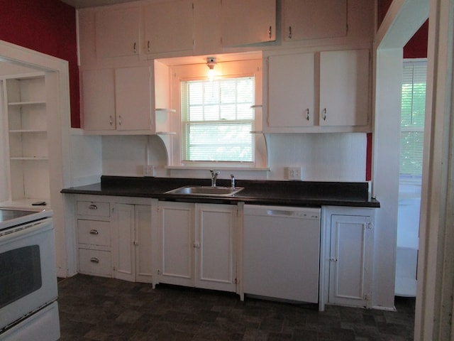 709 E Line St, Kirksville, MO 63501 - kitchen with white appliances, white cabinets, plenty of natural light, and dark countertops
