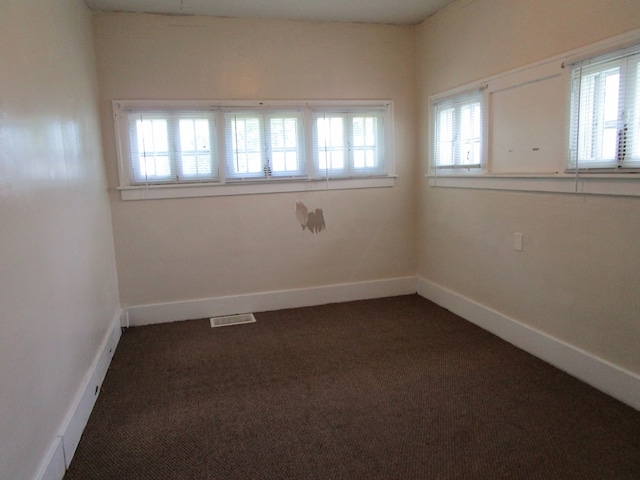 709 E Line St, Kirksville, MO 63501 - unfurnished room with dark colored carpet and baseboards