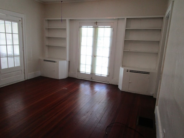 709 E Line St, Kirksville, MO 63501 - unfurnished dining area featuring dark wood-style floors and built in features