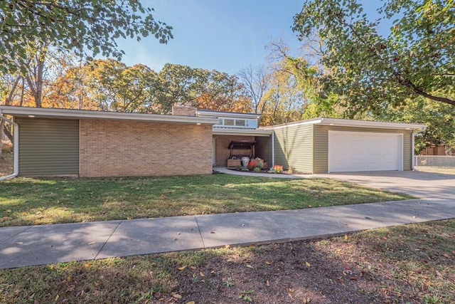 view of front of house with a garage and a front yard