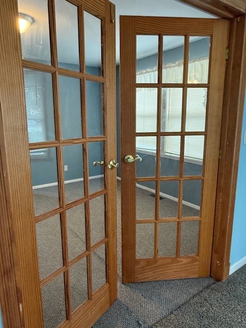 entryway with carpet and french doors