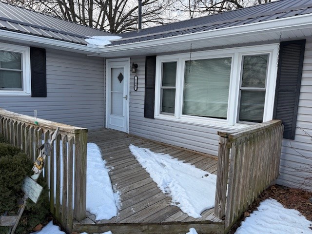 view of snow covered deck