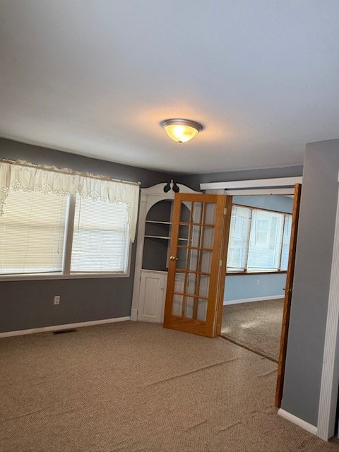 empty room featuring carpet flooring