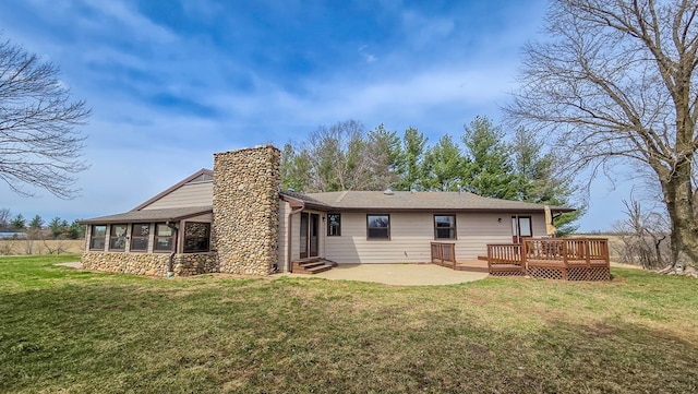 26831 State Highway 11, Kirksville, MO 63501 - rear view of property featuring a wooden deck, stone siding, entry steps, a yard, and a chimney