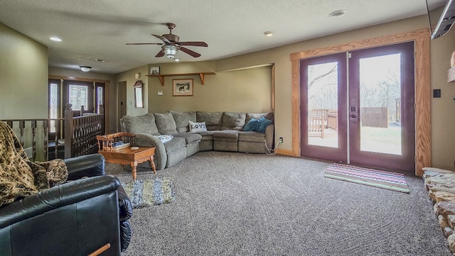 26831 State Highway 11, Kirksville, MO 63501 - carpeted living room with french doors, visible vents, a textured ceiling, and ceiling fan