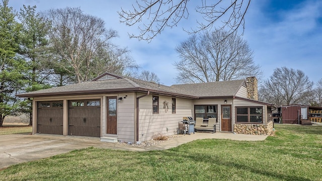 26831 State Highway 11, Kirksville, MO 63501 - exterior space featuring stone siding, roof with shingles, concrete driveway, a chimney, and a front lawn