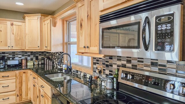 26831 State Highway 11, Kirksville, MO 63501 - kitchen with decorative backsplash, a sink, stainless steel appliances, and light brown cabinetry