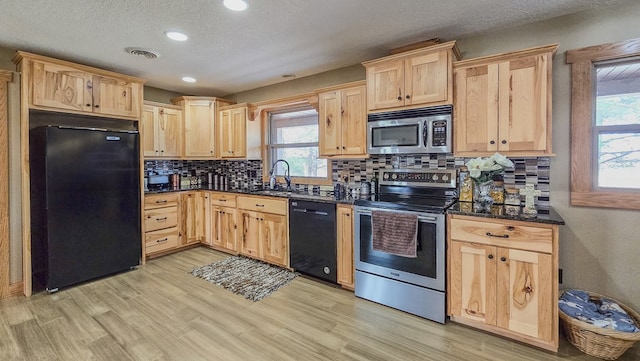 26831 State Highway 11, Kirksville, MO 63501 - kitchen with a sink, light brown cabinets, black appliances, and visible vents