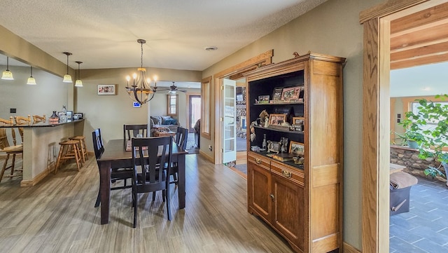 26831 State Highway 11, Kirksville, MO 63501 - dining space with a textured ceiling, wood finished floors, baseboards, and a ceiling fan