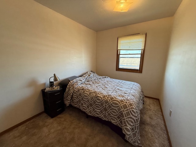 bedroom featuring baseboards and carpet floors