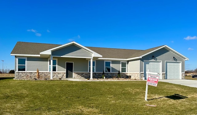 2805 N Gasperi St, Kirksville, MO 63501 - view of front facade featuring a front lawn, covered porch, and a garage