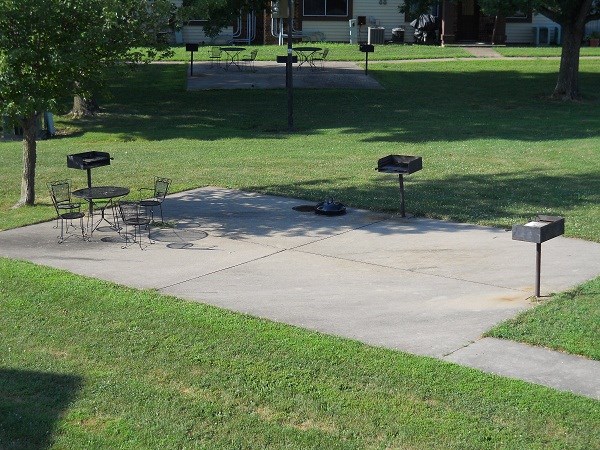 504 Woodwinds Ct, Kirksville, MO 63501 - view of home's community with a lawn and a patio