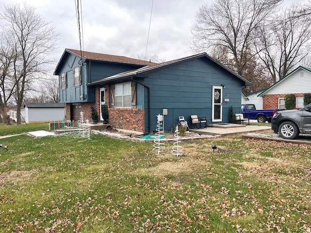 view of side of property featuring a yard and a patio