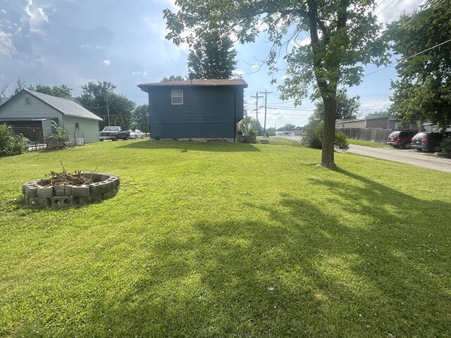 639 Missouri Ave, Chillicothe, MO 64601 - view of green lawn with an outdoor fire pit