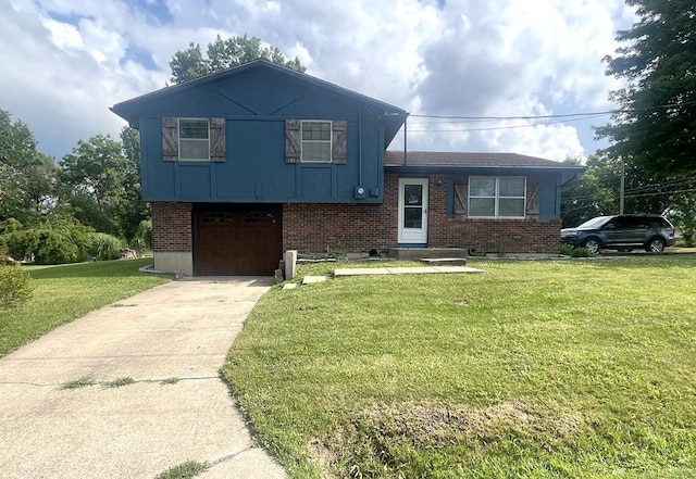 639 Missouri Ave, Chillicothe, MO 64601 - tri-level home with a garage, driveway, a front lawn, and brick siding