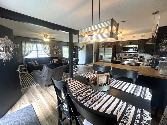 639 Missouri Ave, Chillicothe, MO 64601 - dining room with light wood-style flooring and ceiling fan
