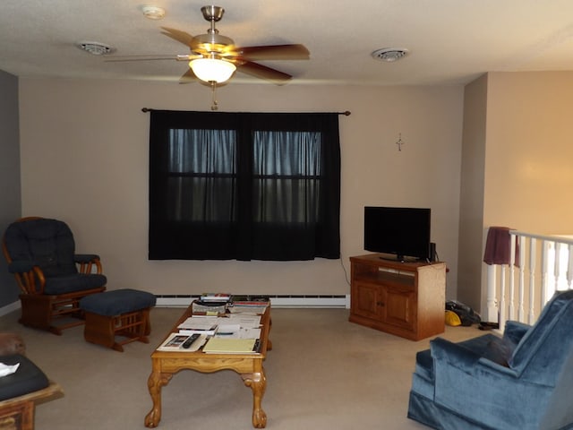 carpeted living room featuring baseboard heating and ceiling fan