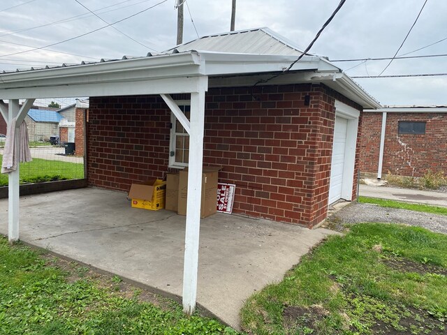 418 Elm St, Chillicothe, MO 64601 - view of patio with a garage