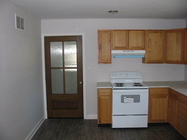 kitchen featuring dark hardwood / wood-style floors and electric stove