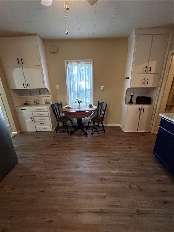 1617 N Church St, Marceline, MO 64658 - dining space with dark wood finished floors and ceiling fan