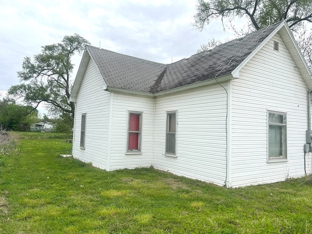 307 4th St, Ludlow, MO 64656 - view of side of property featuring a yard and a shingled roof