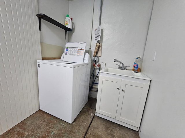 laundry room featuring a sink and washer / dryer