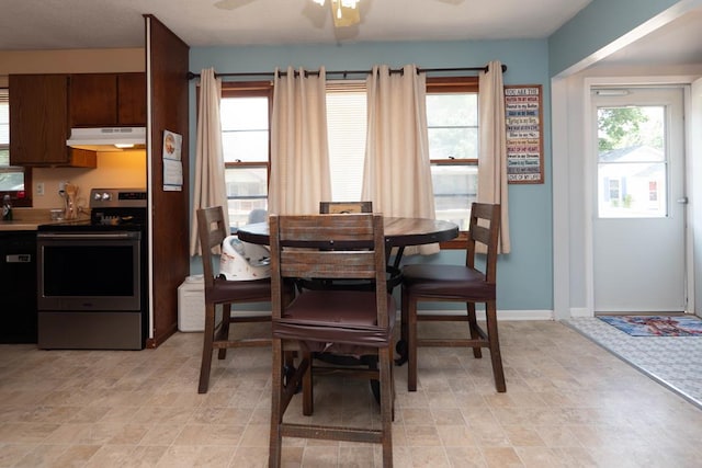 624 Mckinley, Moberly, MO 65270 - dining area with a ceiling fan and baseboards