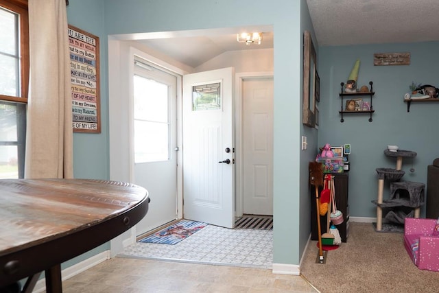 624 Mckinley, Moberly, MO 65270 - carpeted entrance foyer featuring lofted ceiling and baseboards