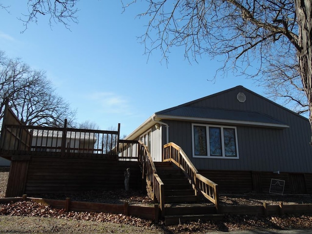 rear view of property with a deck