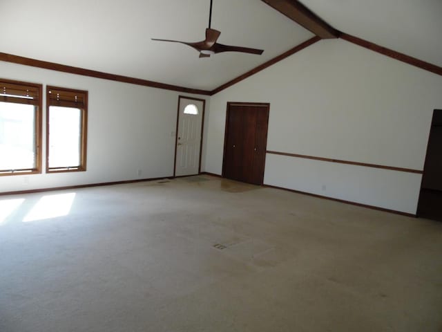 empty room with beamed ceiling, light colored carpet, high vaulted ceiling, and ceiling fan