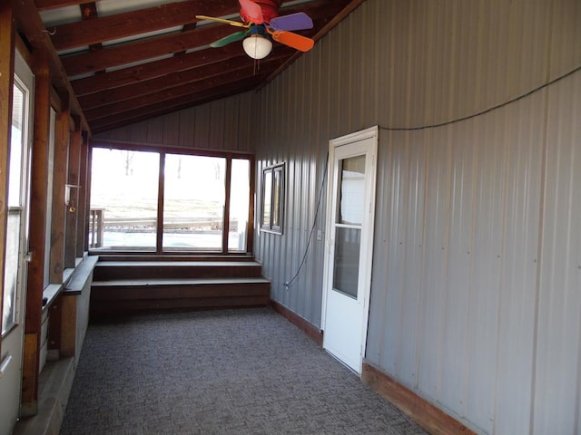 unfurnished sunroom with ceiling fan and lofted ceiling