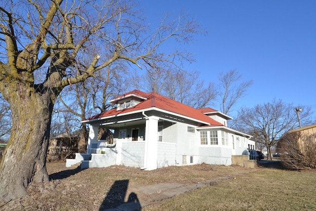 view of property exterior with a porch