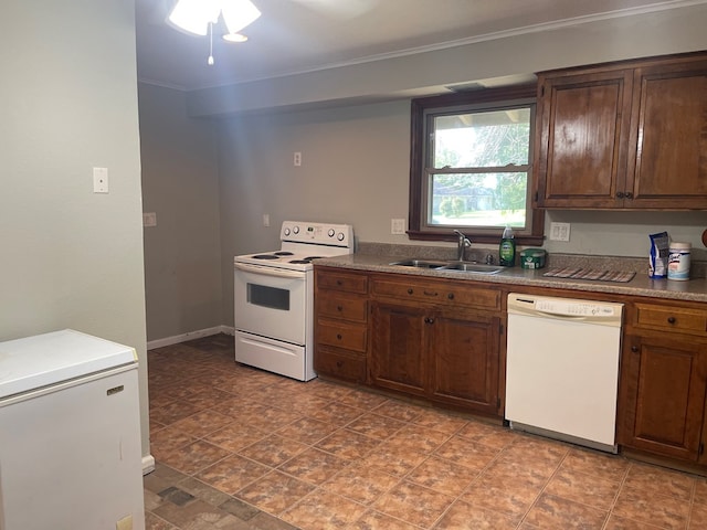 kitchen with ceiling fan, white appliances, sink, and ornamental molding