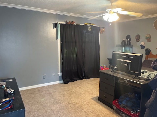 carpeted office space featuring a textured ceiling, ceiling fan, and ornamental molding