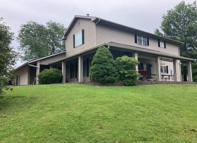 view of front of home with covered porch and a front lawn